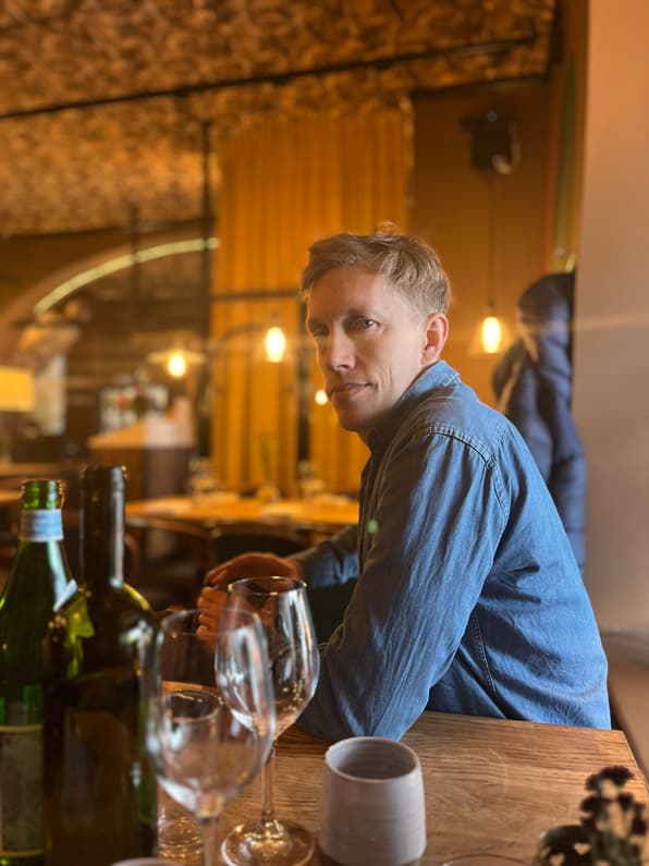 Tobias at a restaurant table